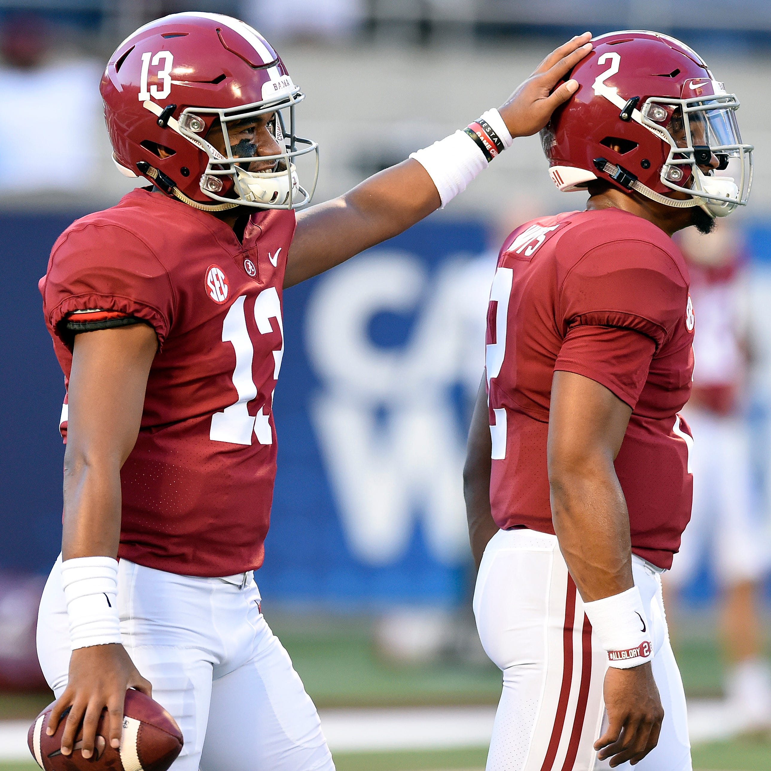 Alabama Crimson Tide quarterbacks Jalen Hurts (2) and Tua Tagovailoa (13) interact before the start of their game against the Louisville Cardinals at Camping World Stadium.