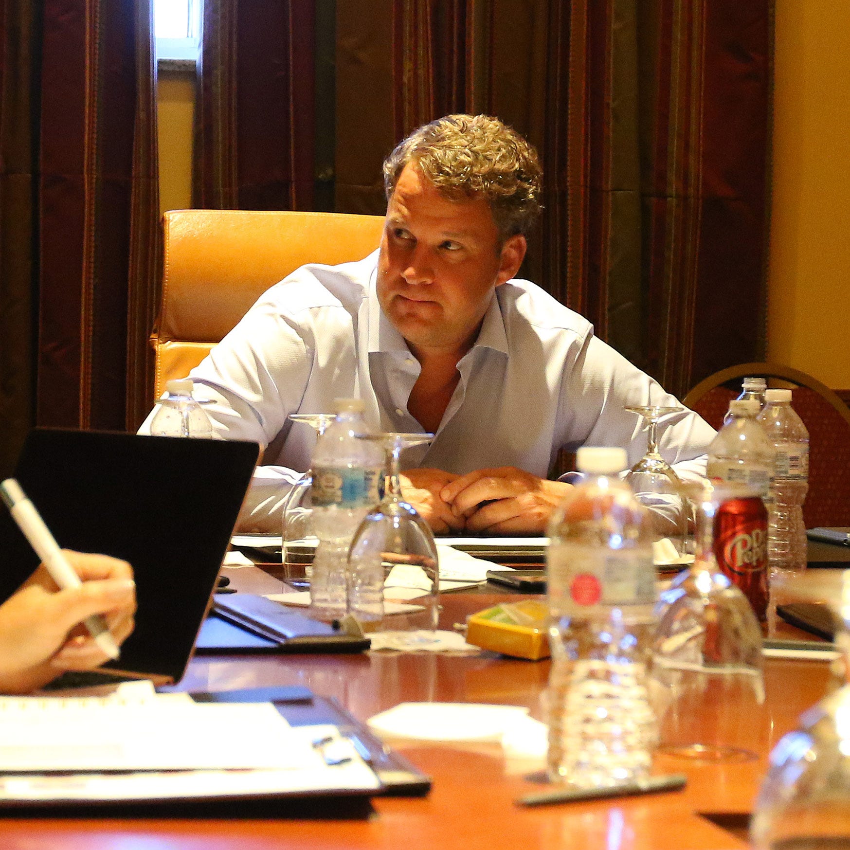Florida Atlantic coach Lane Kiffin sits in a meeting before his team's game against Oklahoma.