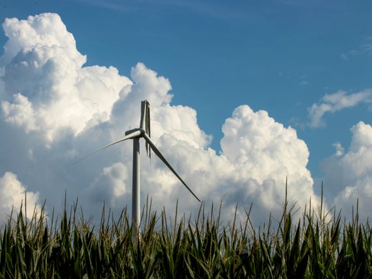The dangling blade of a wind turbine near Zearing after a summer tornado was later struck by lightning, according to photographer Don Henderson.