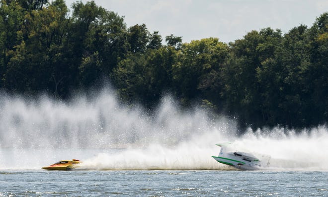 Chris Ritz (right) nearly flips his boat during a National Modified heat race last year at HydroFest. This year, admission to watch the racing on Aug. 16-18 is free.