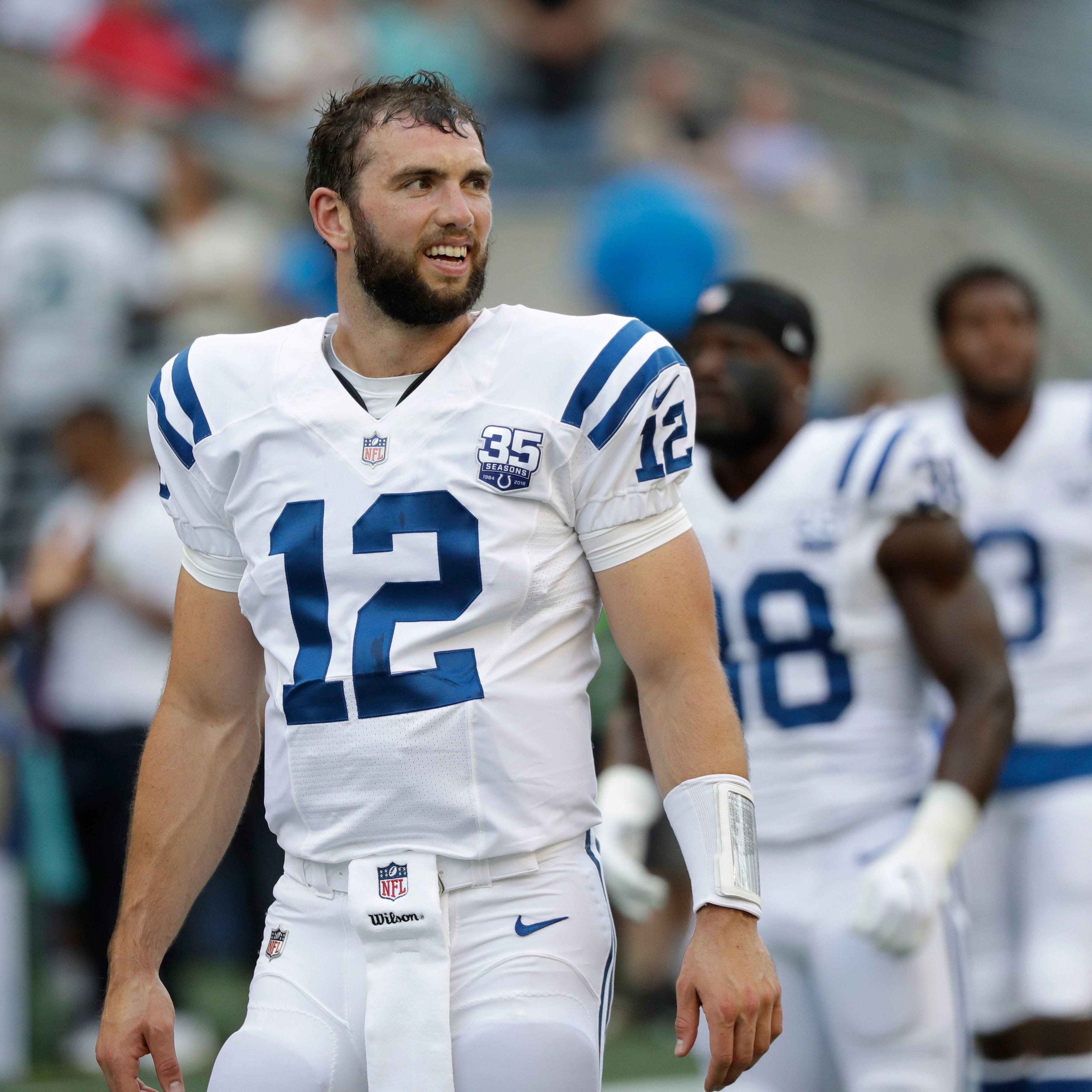 Indianapolis Colts quarterback Andrew Luck stands on the field before an NFL football preseason game against the Seattle Seahawks, Thursday, Aug. 9, 2018, in Seattle. (AP Photo/Elaine Thompson)