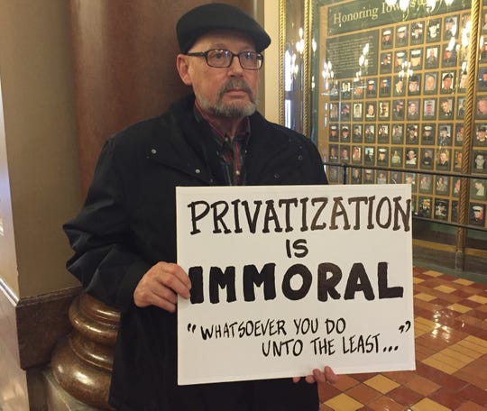 Eric Stimson, protesting the state's plans to privatize Medicaid health care for low-income and disabled Iowans, at the Iowa Capitol in February 2016.