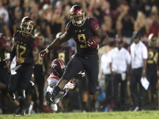FSU's Jacques Patrick bereaks away from Virginia Tech's Divine Deablo during their game at Doak Campbell Stadium in Tallahassee, Fla. on Monday, Sept. 3, 2018.