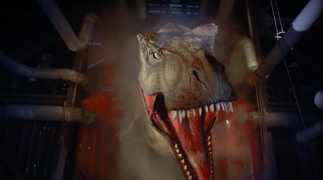 The T-Rex in the "Jurassic Park" ride gives guests a final scare before their wet free fall.