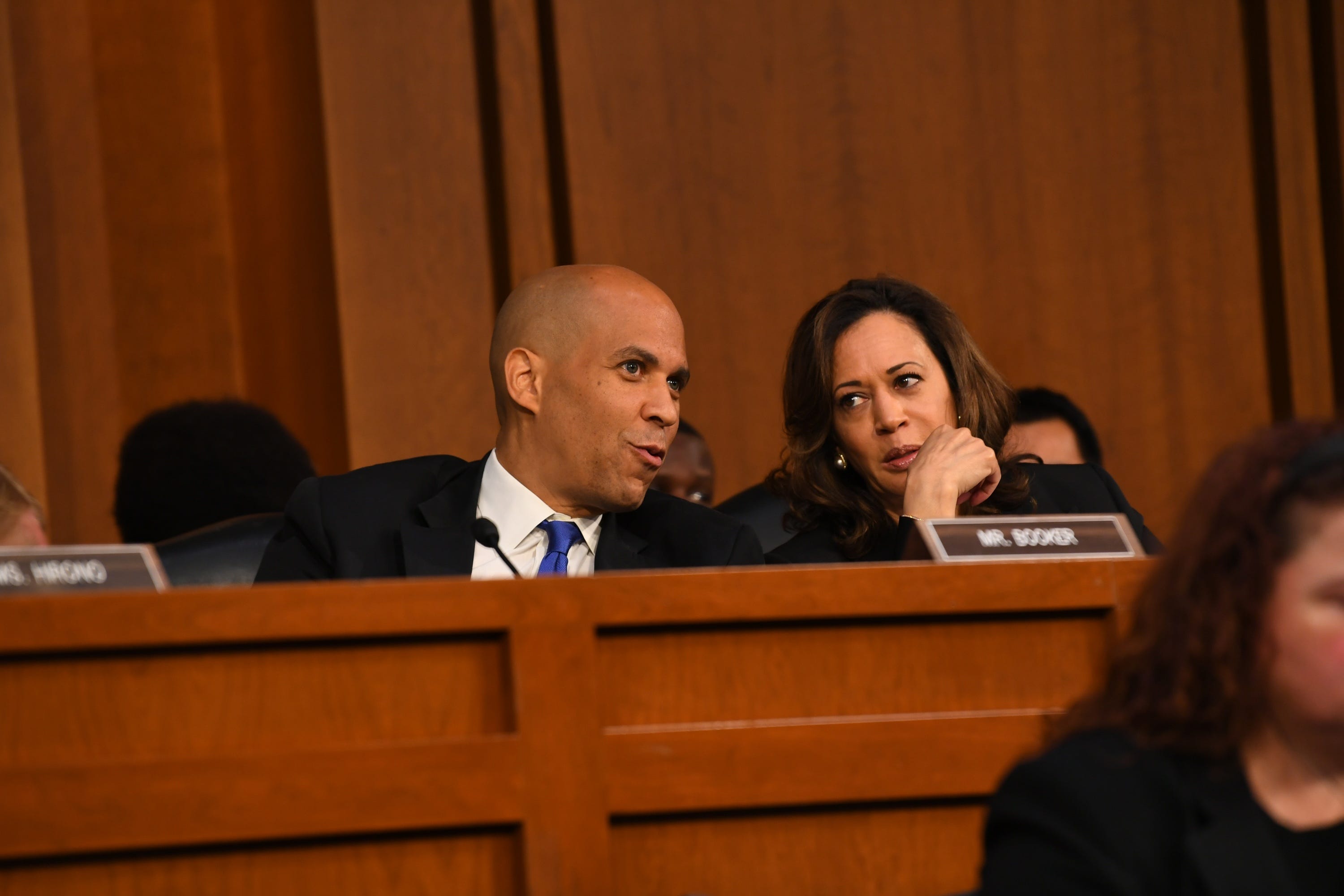 Sen. Corey Booker (D-N.J.) and Sen. Kamala Harris (D-Calif.) confer during the confirmation hearing for Supreme Court Associate Justice nominee Brett Kavanaugh on Sept. 4, 2018 in Washington. 