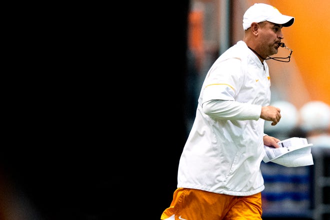 Tennessee head coach Jeremy Pruitt runs on the field during a fall football practice at Haslam Field in Knoxville on Wednesday, September 5, 2018.