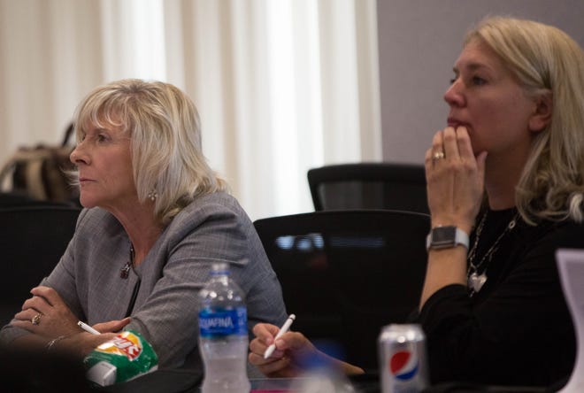 New Mexico State University Regents Chair Debra Hicks, left, and Vice Chair Kari Mitchell, right, listen to the results of an institutional analysis during a work session Wednesday, Sept. 5, 2018, at Corbett Center.