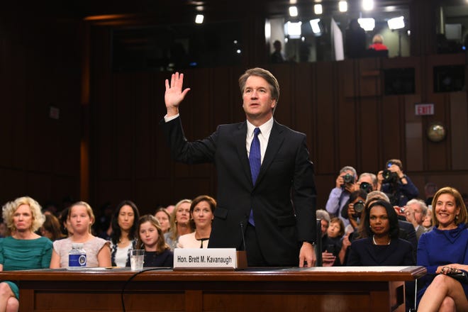 9/4/18 4:37:12 PM -- Washington, DC, U.S.A  -- Supreme Court Associate Justice nominee Brett Kavanaugh is sworn in as he appears before the Senate Judiciary Committee during his confirmation hearing on Sept. 4, 2018 in Washington. Kavanaugh was nominated by President Donald Trump to replace Justice Anthony Kennedy,who retired from the Supreme Court in July.  --    Photo by Jack Gruber, USA TODAY Staff ORG XMIT:  JG 137433 Kavanaugh Confir 9/4/2018 (Via OlyDrop)