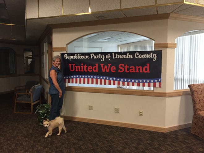 Ann Eby of the Federated Republican Women of Lincoln County stands in the new Republican Party headquarters in the Lincoln Tower.