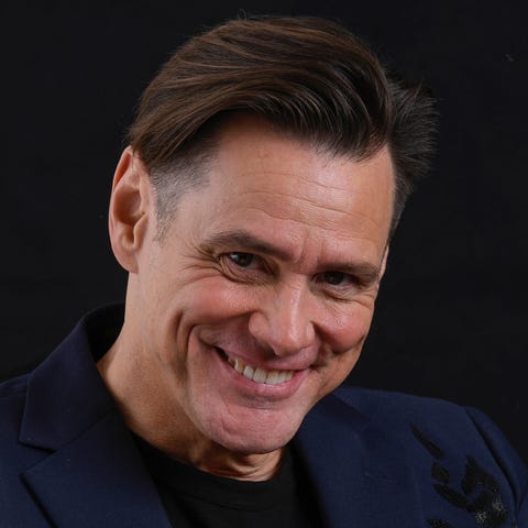 Jim Carrey gets comfortable during a photo shoot...