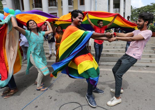 Supporters and members of the LGBT community dance to celebrate after the country's top court struck down a colonial-era law that made homosexual acts punishable by up to 10 years in prison, in Bangalore, India, Sept. 6, 2018. 