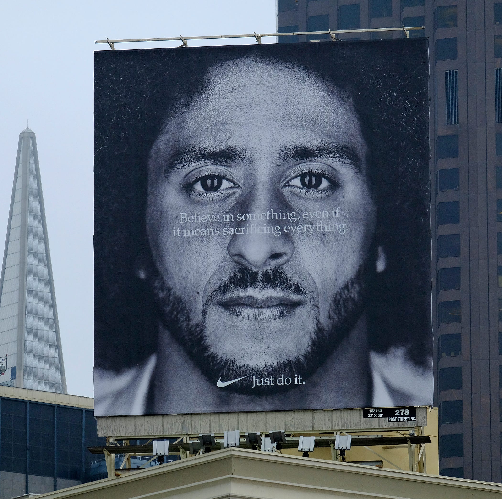 A large billboard stands on top of a Nike store at Union Square in San Francisco showing former 49ers quarterback Colin Kaepernick.