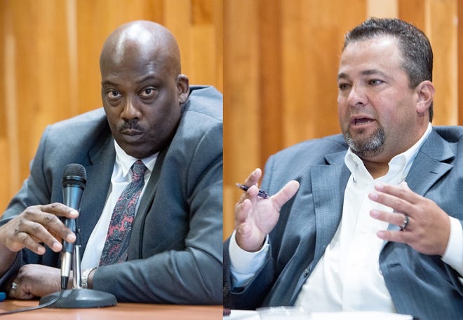 Buncombe County sheriff candidates Quentin Miller, left and Shad Higgins, right, debate Friday morning.