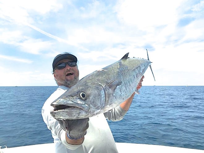 Recreational fishing for fish like this giant king mackerel caught by Capt. Scott Lum is a $49.8 billion industry in the United States.