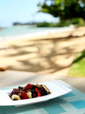 ​An aaçaí bowl resplendent with fresh fruit is served outside at Kahala Hotel and Resort in Oahu, Hawaii.
​