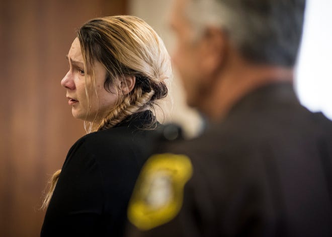 Theresa Gafken looks over her shoulder while in court Friday, Sept. 7, 2018.  Gafken, 36, is facing second-degree murder and other charges in a fatal crash that happened April 11.