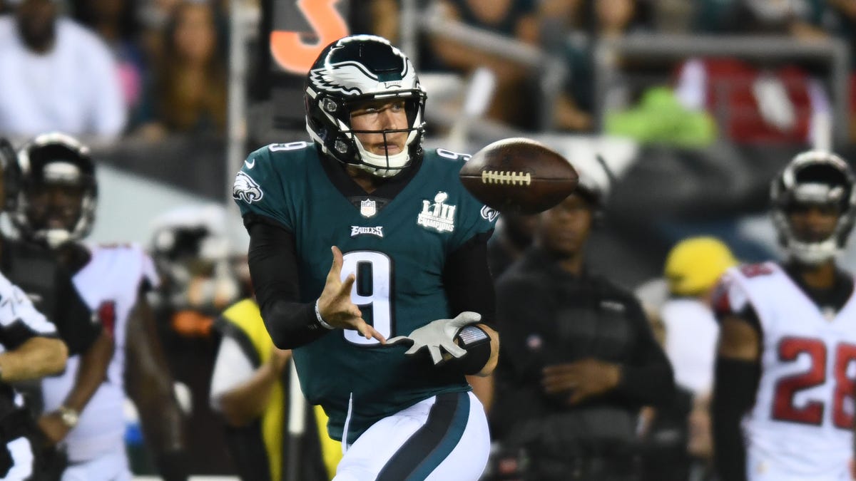 Nick Foles hauls in a pass from receiver Nelson Agholor in the third quarter.