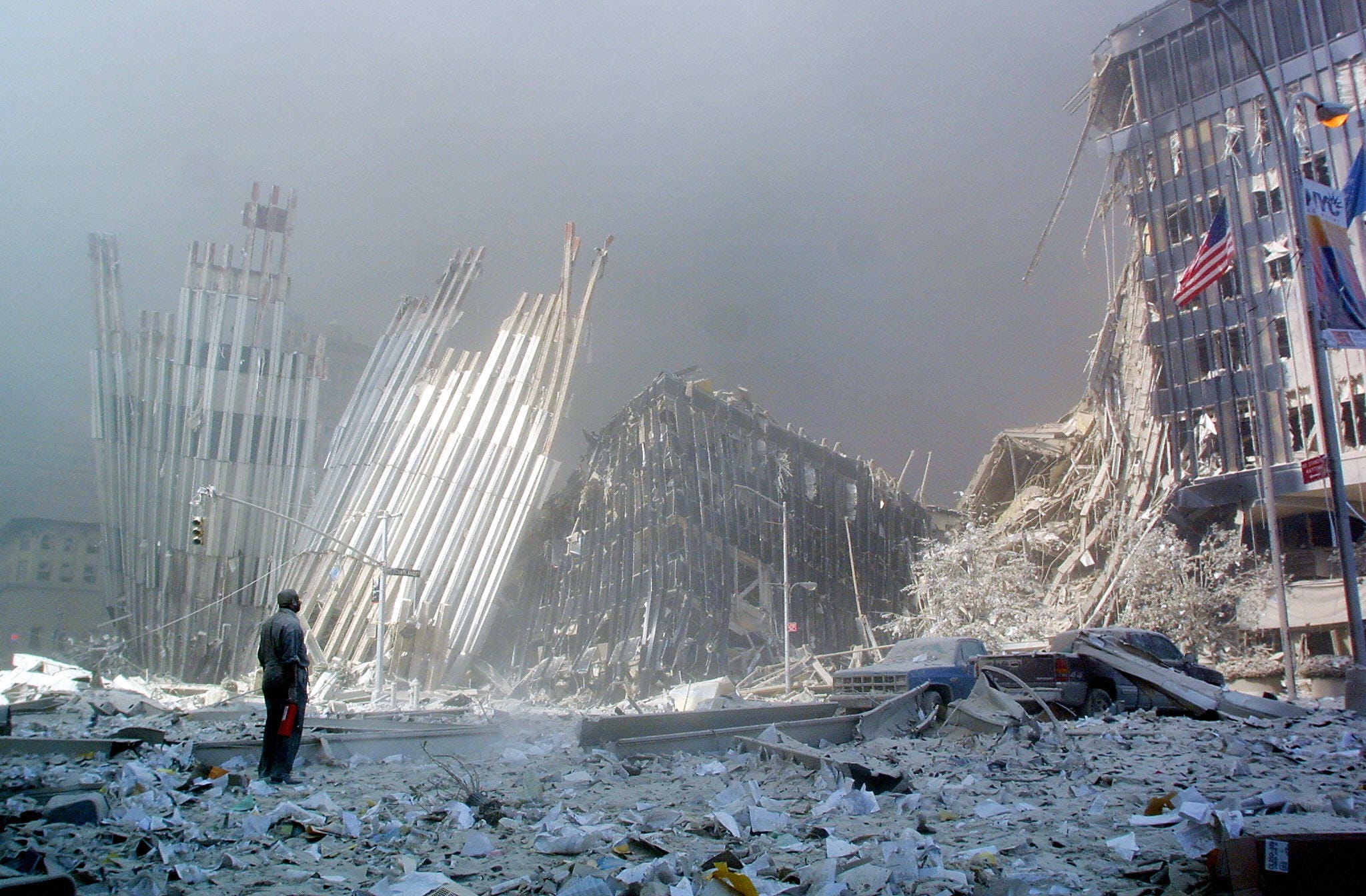 A man calls out for survivors amid the rubble of the first World Trade Center tower in New York.