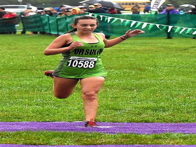 Hannah Doerger of Ursuline finished strong in first place in the girls varsity large school run at the 44th Annual Mason Cross Country Invitational, Sept. 8, 2018.