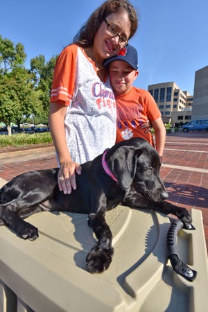 Sam Morrison, a patient with cerebral palsy at Shriners Hospital was presented with Halley, a dog with an underdeveloped foot Saturday, September 8, 2018. Along with Sam was his family, brothers Charlie and Zach with parents Jon and Allison.