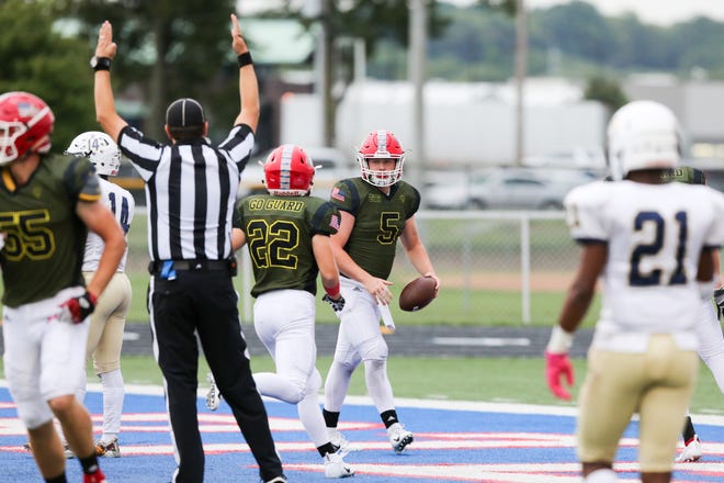 Martinsville's Travis Griffey (5) celebrates his touchdown run during the first half of Martinsville vs. Decatur Central High School varsity football held at Martinsville High School, September 7, 2018.