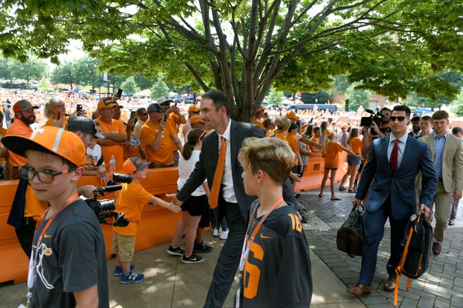 Tennessee offensive coordinator Tyson Helton, center, said he was amazed by the Vol Walk before Saturday's game against East Tennessee State and described the experience on Monday as "something very, very special."
