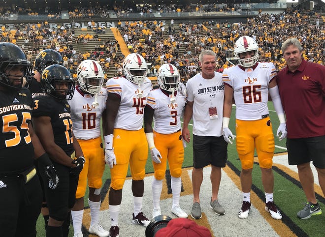 USM's Brett Favre (left) and ULM's Doug Pederson (right) served as honorary captains for their alma maters on Saturday at M.M. Roberts Stadium.