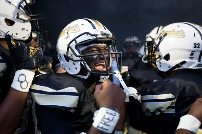 Springfield’s Dayron Johnson (23) yells with his teammates before Springfield's game against Station Camp at Springfield High School in Springfield on Friday, Sept. 7, 2018.