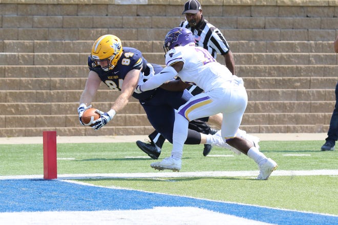 Augustana's tight end Chet Peerenboom dives to the endzone for the score in their game against Minnesota State-Mankato. Minnesota State won 38-36.