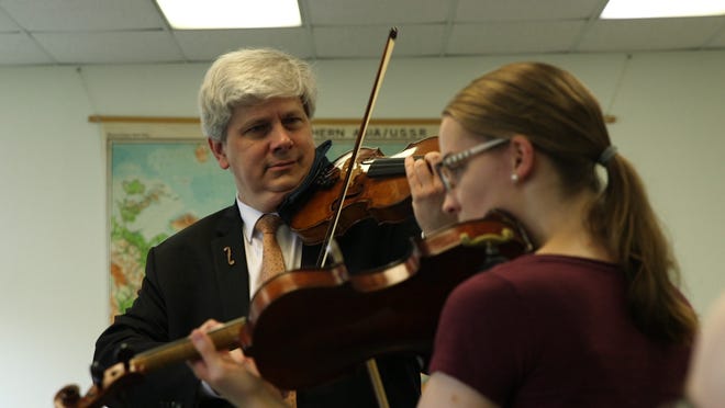New Artistic Director and faculty member of Heifetz Nicholas Kitchen plays with a student at Heifetz International Music Institute.