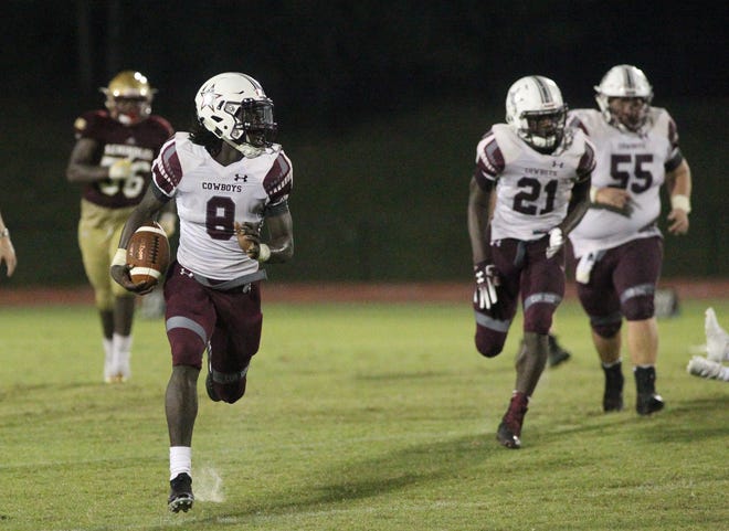 Madison County quarterback Travis Jay runs for a 55-yard touchdown as the Cowboys beat Florida High 33-17 on Friday, Sept. 7, 2018.