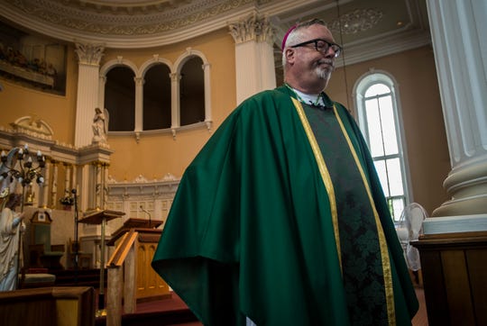 Burlington Roman Catholic Diocese Bishop Christopher Coyne answers questions after mass at St. Joseph's Cathedral on Sunday, Sept. 9, 2018, about a new investigation into alleged abuses at a former Catholic orphanage highlighted in recent a BuzzFeed News report.