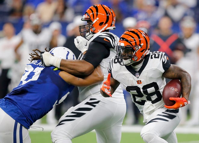 Cincinnati Bengals running back Joe Mixon (28) runs to the outside on a carry in the second quarter of the NFL Week One game between the Indianapolis Colts and the Cincinnati Bengals at Lucas Oil Stadium in Indianapolis on Sunday, Sept. 9, 2018. The Colts led 16-10 at halftime. 