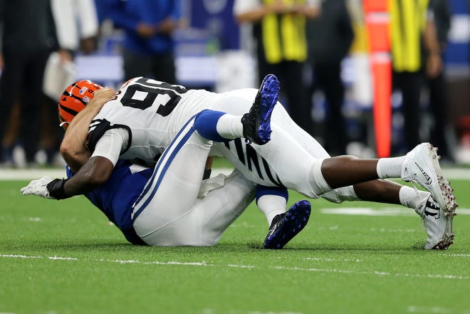 Cincinnati Bengals defensive end Carlos Dunlap (96) is penalized for unnecessary roughness after hitting Indianapolis Colts quarterback Andrew Luck (12) in the third quarter during the Week 1 NFL game between the Cincinnati Bengals and the Indianapolis Colts, Sunday, Sept. 9, 2018, at Lucas Oil Stadium in Indianapolis. Cincinnati won 34-23. 