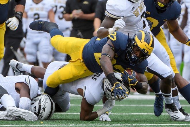 Michigan running back Karan Higdon rushed for 156 yards and a touchdown in Saturday's win over Western Michigan.
