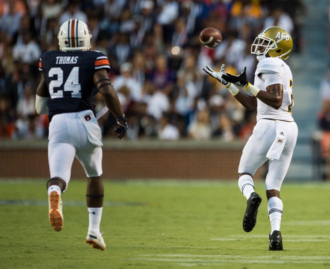 Alabama State’s Dieuly Aristilde, Jr. (2) catches a long pass guarded by Auburn’s Daniel Thomas (24) at Jordan-Hare Stadium in Auburn, Ala., on Saturday, Sept. 8, 2018. Auburn leads Alabama State 42-2 at halftime. 