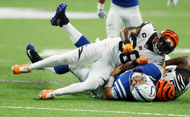 Cincinnati Bengals safety Shawn Williams (36) is ejected on this play for a late hit and helmet to helmet contact on Indianapolis Colts quarterback Andrew Luck (12) during the first quarter at Lucas Oil Stadium.