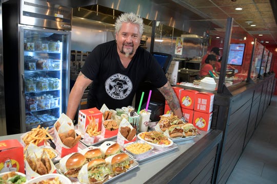 Food Network S Guy Fieri Opens Chicken Guy At Disney Springs In