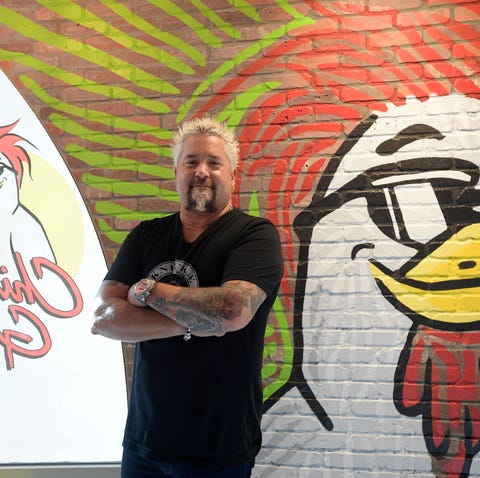 Chef Guy Fieri celebrated the opening of Chicken...