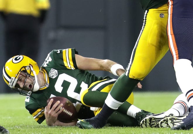 Green Bay Packers' Aaron Rodgers is injured in the second quarter against the Chicago Bears in the season opener on Sunday, September 9, 2018, at Lambeau Field in Green Bay, Wis.
