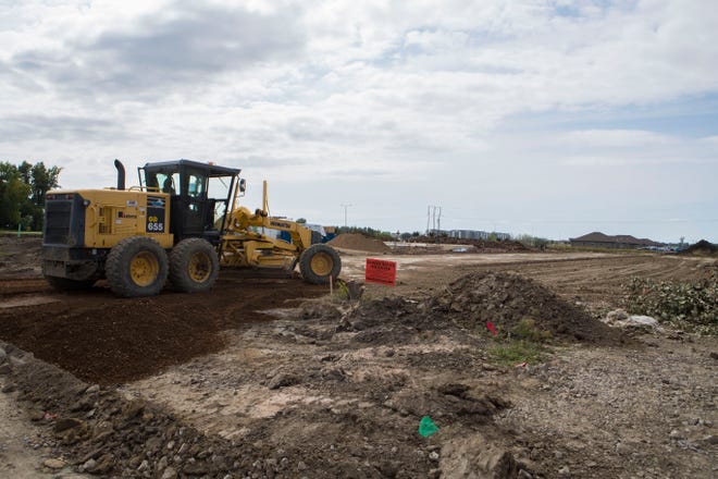 Construction is shown on E 57th Street and S Dubuque Avenue in Sioux Falls, S.D. on Monday, Sept. 10, 2018.