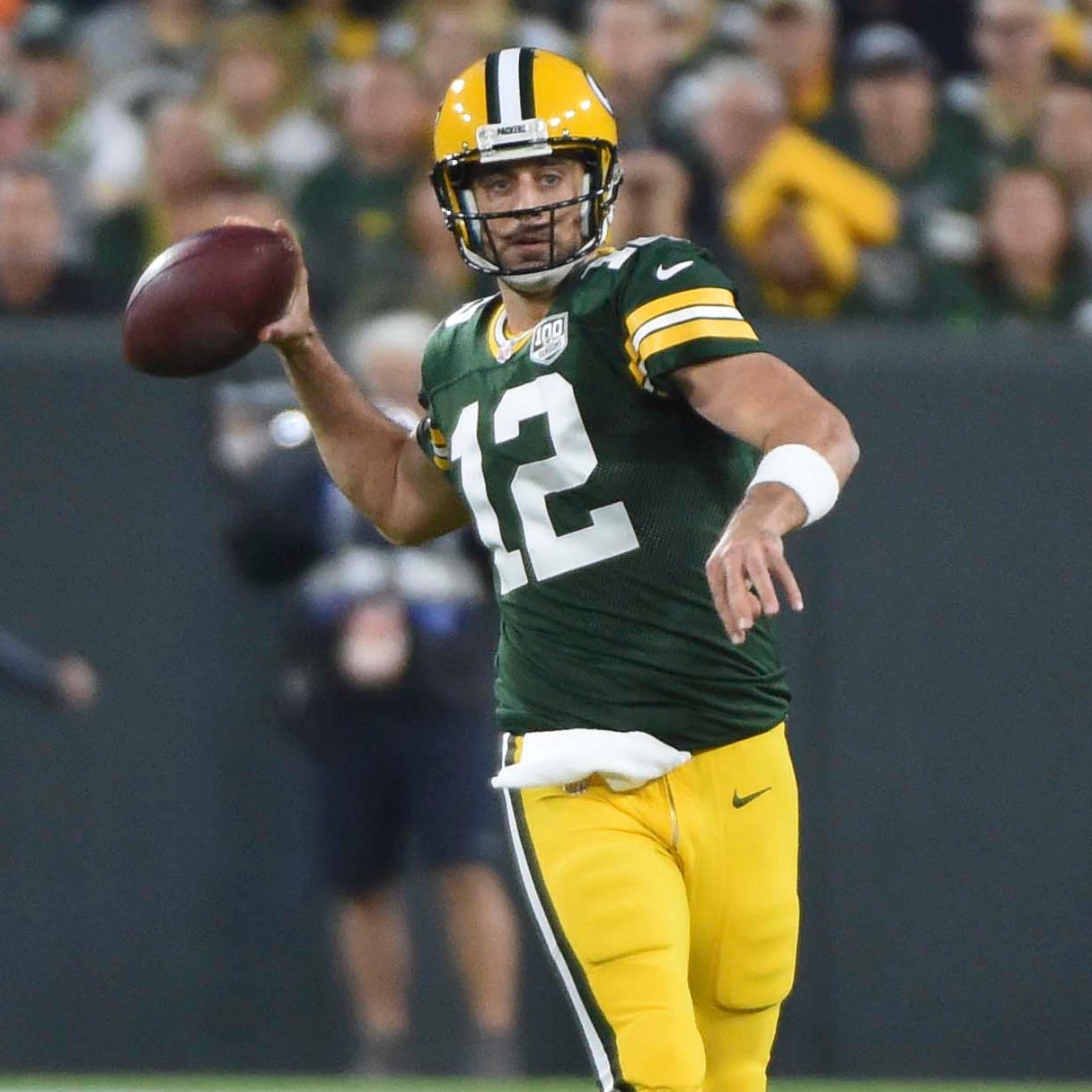 Green Bay Packers quarterback Aaron Rodgers (12) gets pressure from Chicago Bears linebacker Leonard Floyd (94) in the first quarter at Lambeau Field.