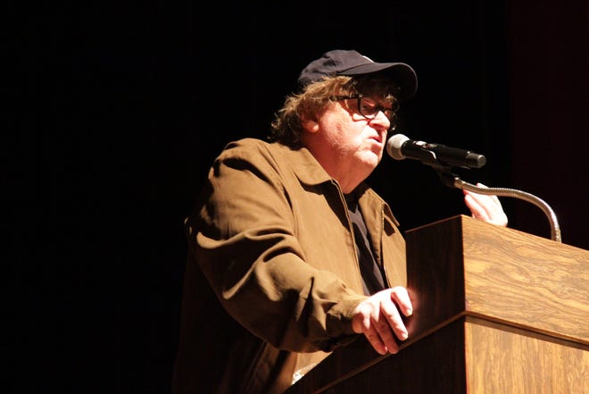 Flint documentary filmmaker Michael Moore addresses the audience during a screening of his new film, "Fahrenheit 11/9" at The Whiting auditorium in Flint on Monday, Sept. 10, 2018.
