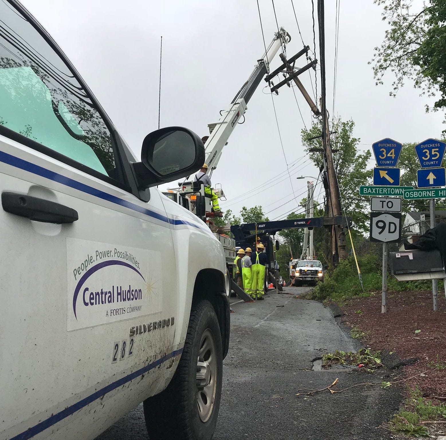 A Central Hudson Gas & Electric Corp. crew works to replace a utility pole at an intersection in Fishkill.