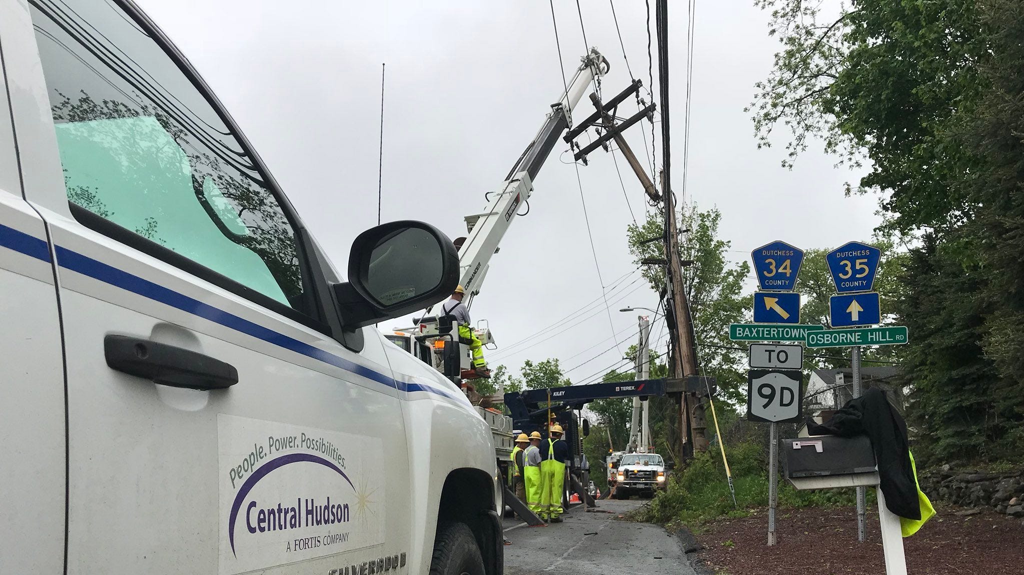 A Central Hudson Gas & Electric Corp. crew works to replace a utility pole at an intersection in Fishkill.