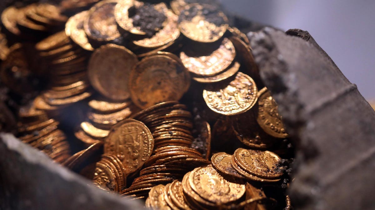 A hungry badger looking for food in a cave found a trove of ancient Roman coins instead