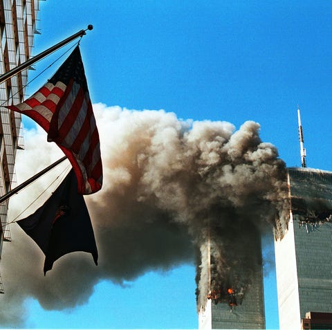 Smoke pours from the World Trade Center after bein