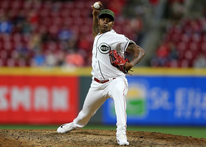 Cincinnati Reds relief pitcher Raisel Iglesias (26) delivers in the ninth inning during a baseball game between the Los Angeles Dodgers and the Cincinnati Reds, Tuesday, Sept. 11, 2018, at Great American Ball Park in Cincinnati.