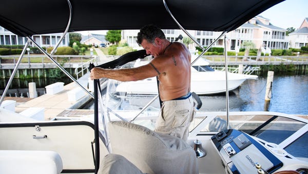 Masten Cloer prepares his boat for Hurricane...