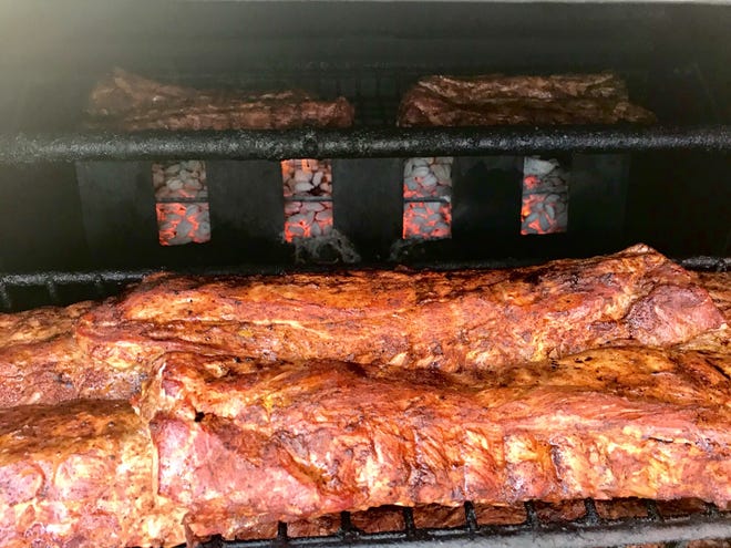 Ribs smoking at BigCountry's Barbecue. The restaurant is getting a new location on the northwest side, 8663-8665 W. Brown Deer road.